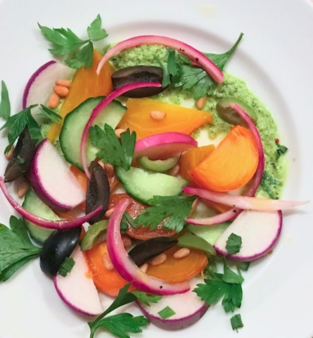 Baco Mercat cookbook salad with beets, radishes, parsley, cucumbers, nuts, pickled red onion, and poblano feta dressing