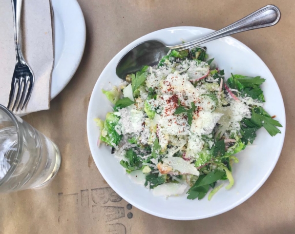 Baco Mercat Caesar Brussels sprouts with Pecorino, anchovy, garlic, Dijon mustard, pickled red onions, caraway bread crumbs, parsley